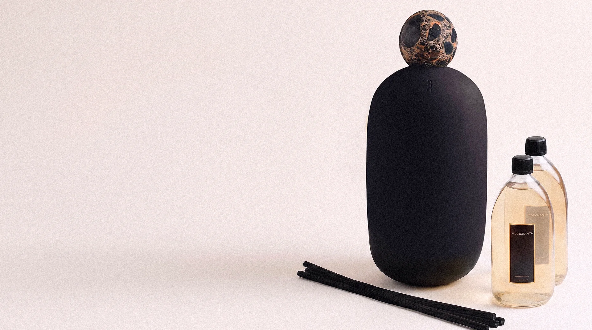 Detail of Botella and Tinaja exquisite home scents vessel in warm tropical light