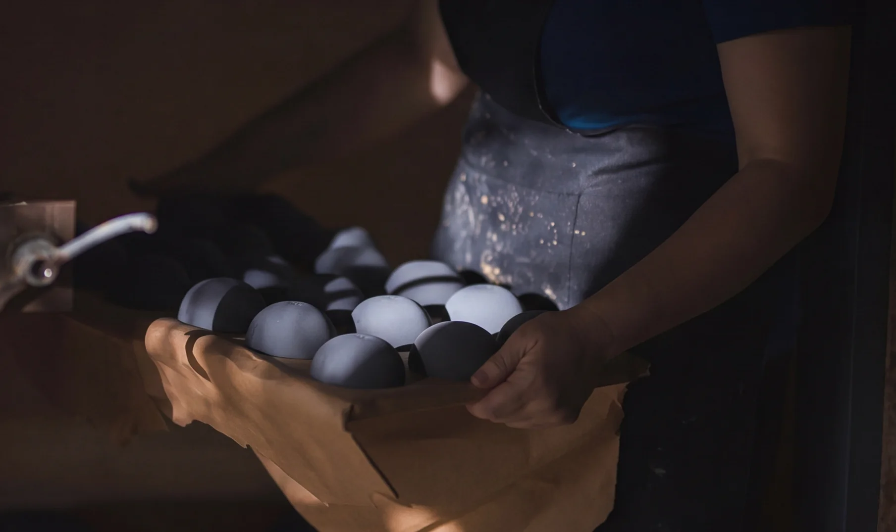 Polishing the handcrafted ceramic finish for luxury candle vessels